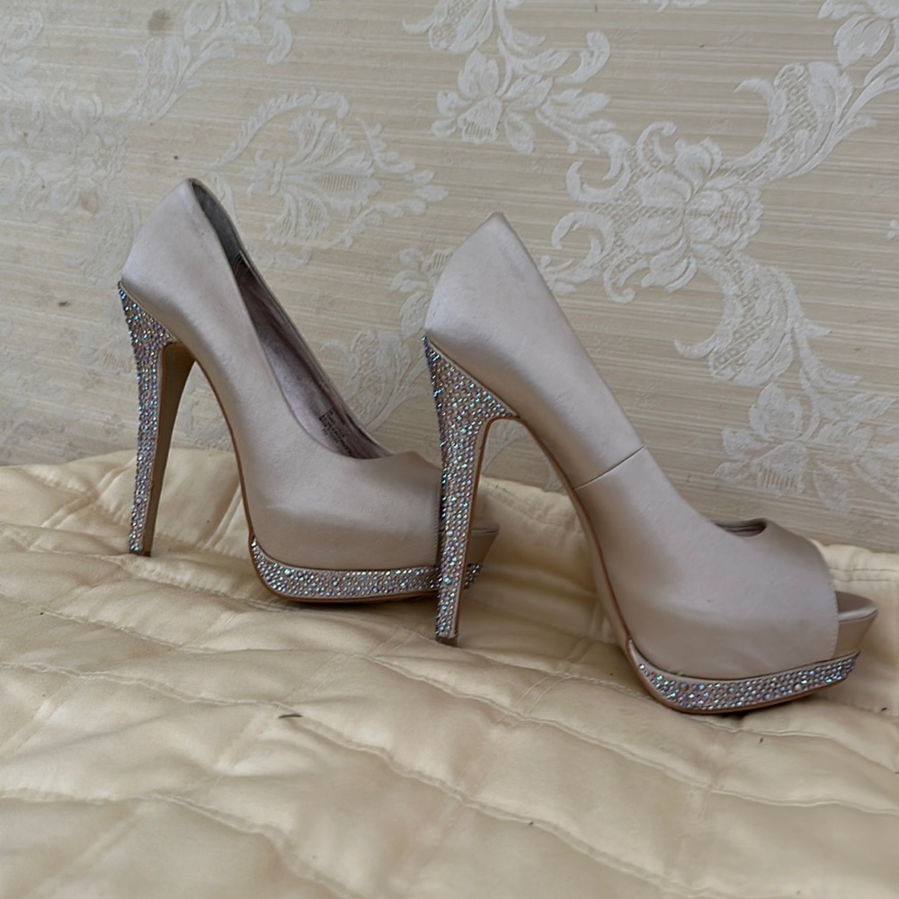 It is New silk beige open toe with high heels and platform
